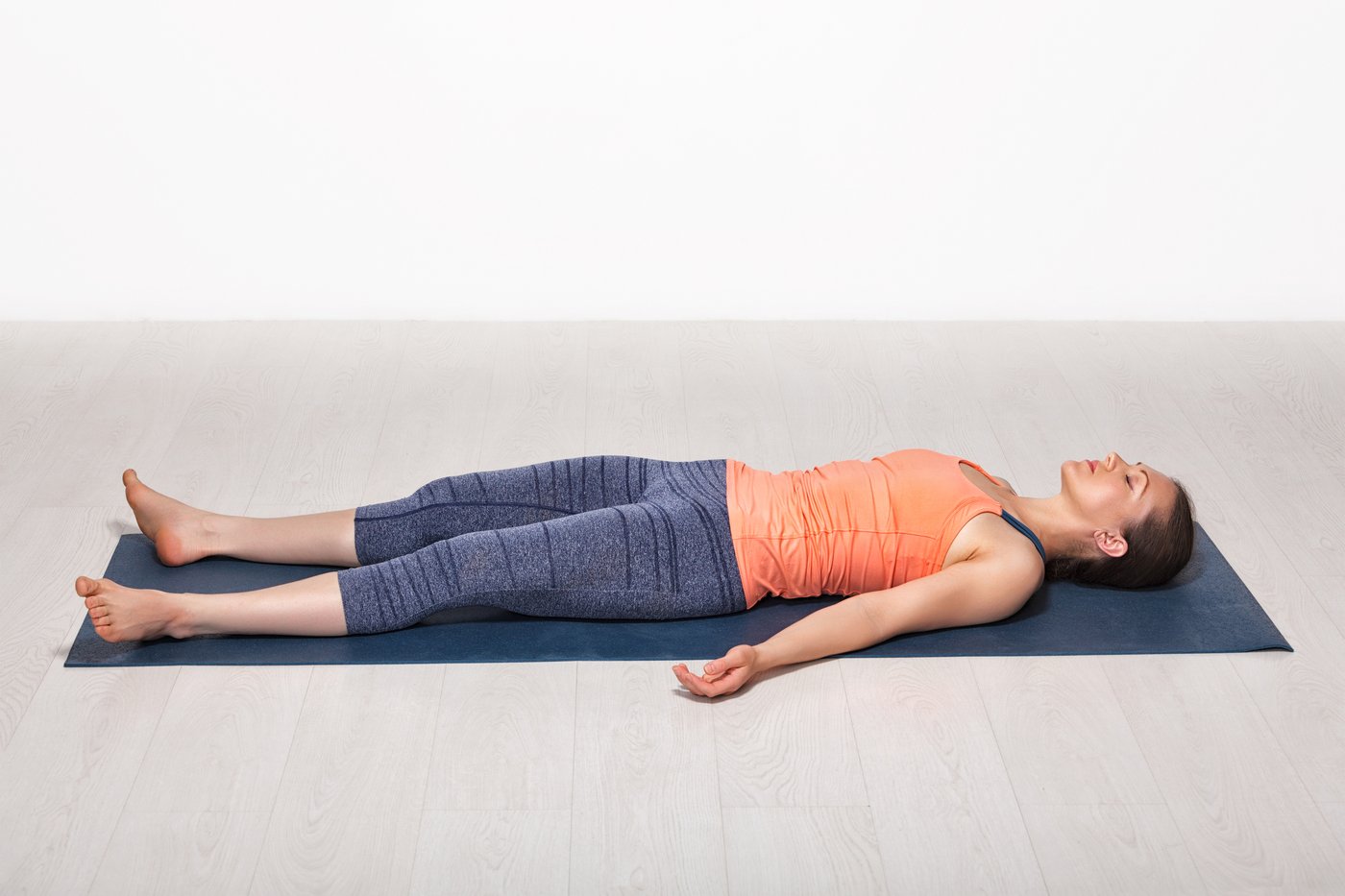 Lying relaxed in a calm, minimal space, settling the body before beginning the visualization